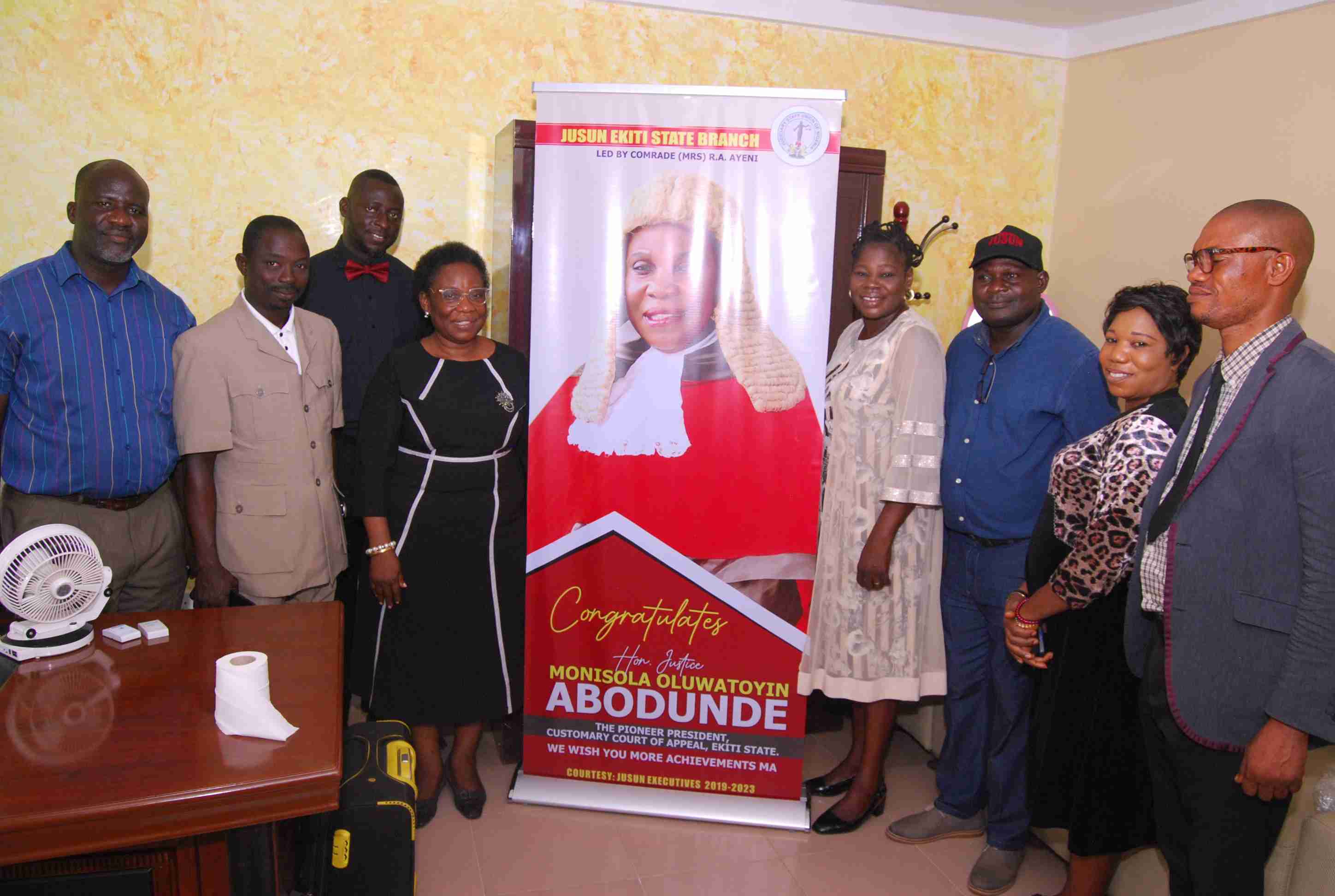 JUSUN Executives Presenting a Congratulatory Banner to the Hon. Justice M.O. Abodunde for His Attainment as The Pioneer PCCA on 22nd March, 2023